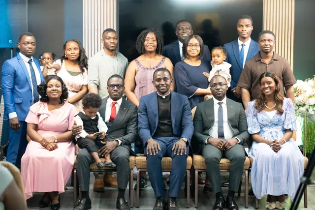 The Radiant City Church family and leaders gathered for a group photo, with the pastor seated in the centre