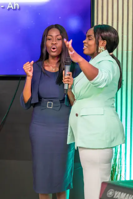 Two women leading worship together