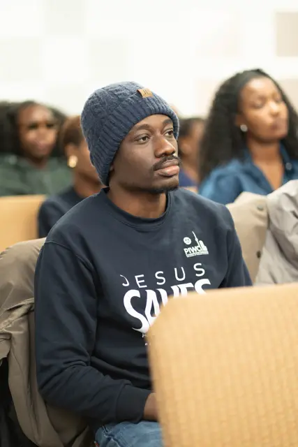 A young man in a Jesus Saves hoodie