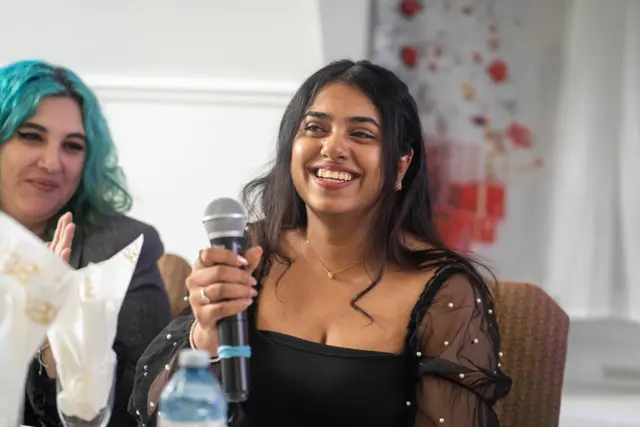 Singers leading worship with microphones