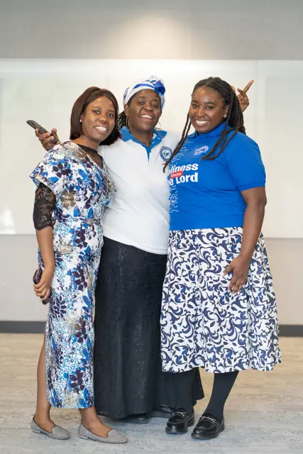 Three women smiling together