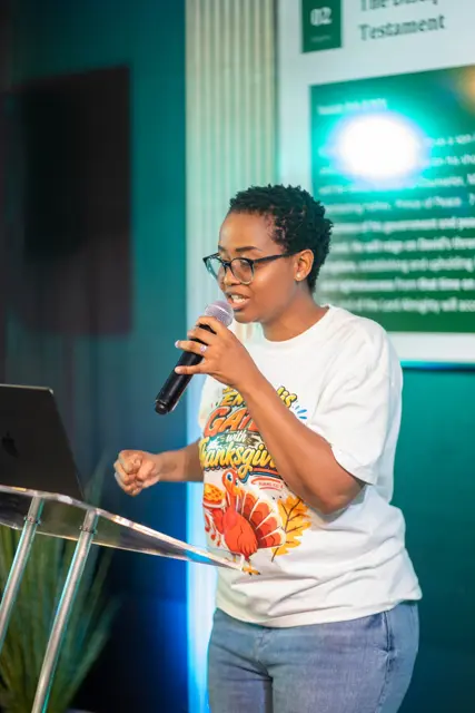 A woman sharing from the pulpit during service