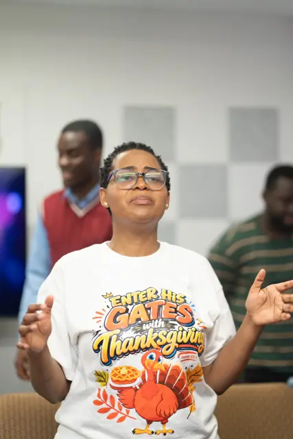 A woman worshipping with open hands